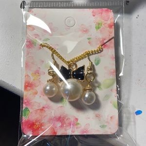 Faux Pearl Necklace and matching earrings.